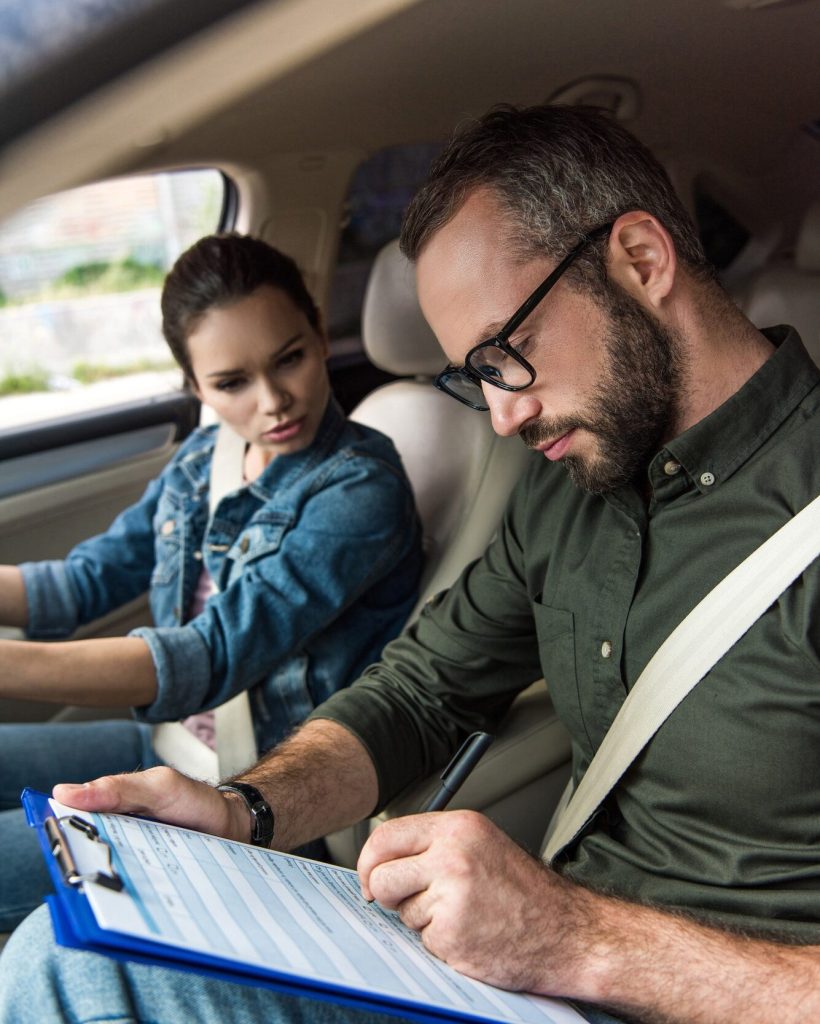 teacher-writing-something-to-clipboard-during-driving-test.jpg teacher-writing-something-to-clipboard-during-driving-test.jpg
